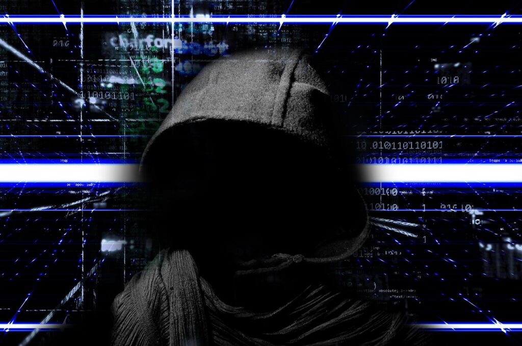 black-hat SEO: pratiche scorrette di posizionamento sul web - hacker con cappuccio e sfondo dati